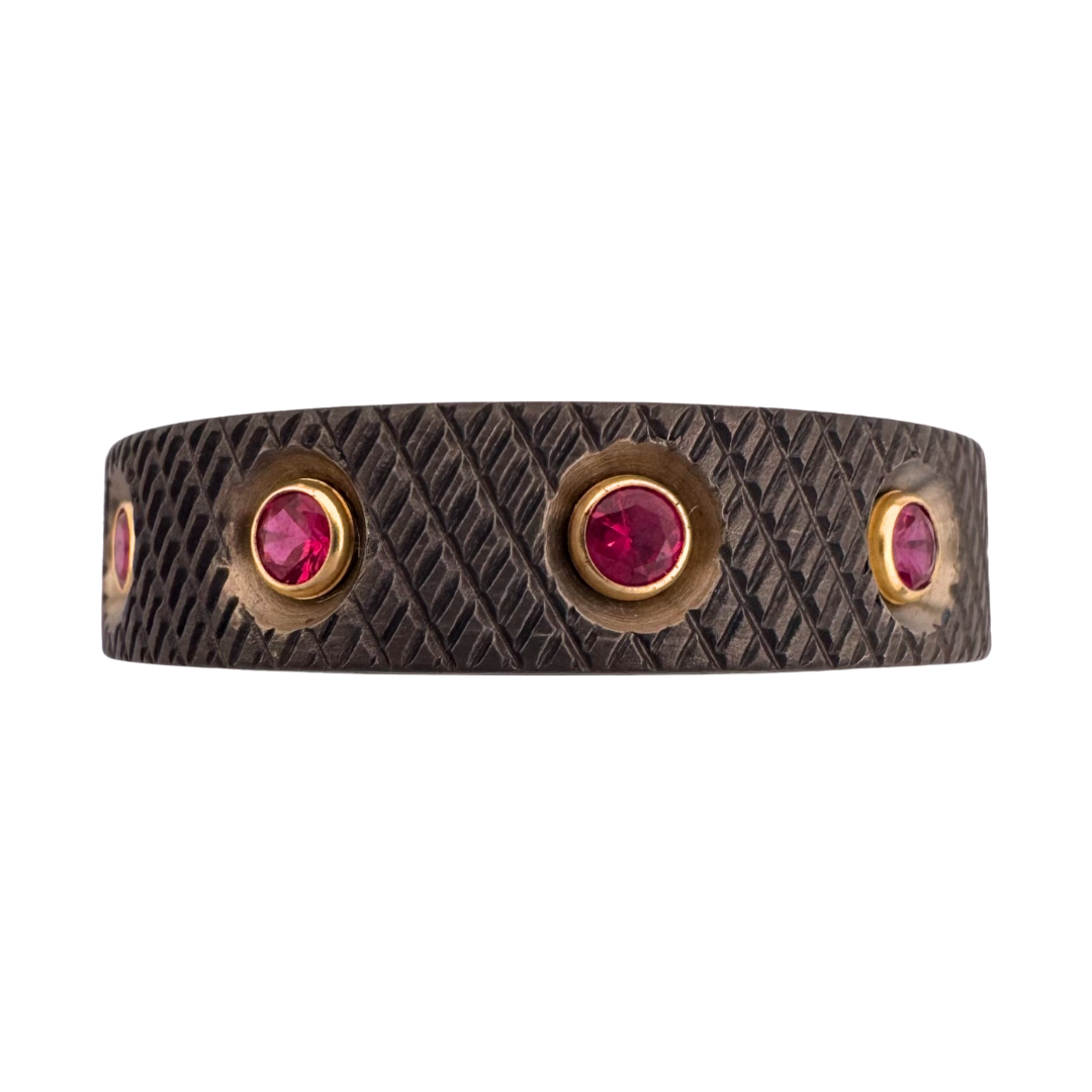 Titanium knurled band with (10) 2mm rubies in gold settings