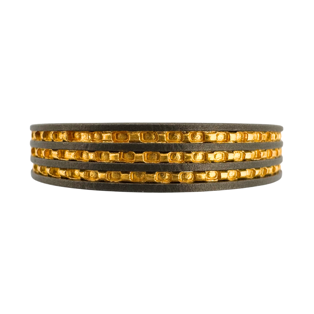 Titanium, with (3) 24K gold inlays