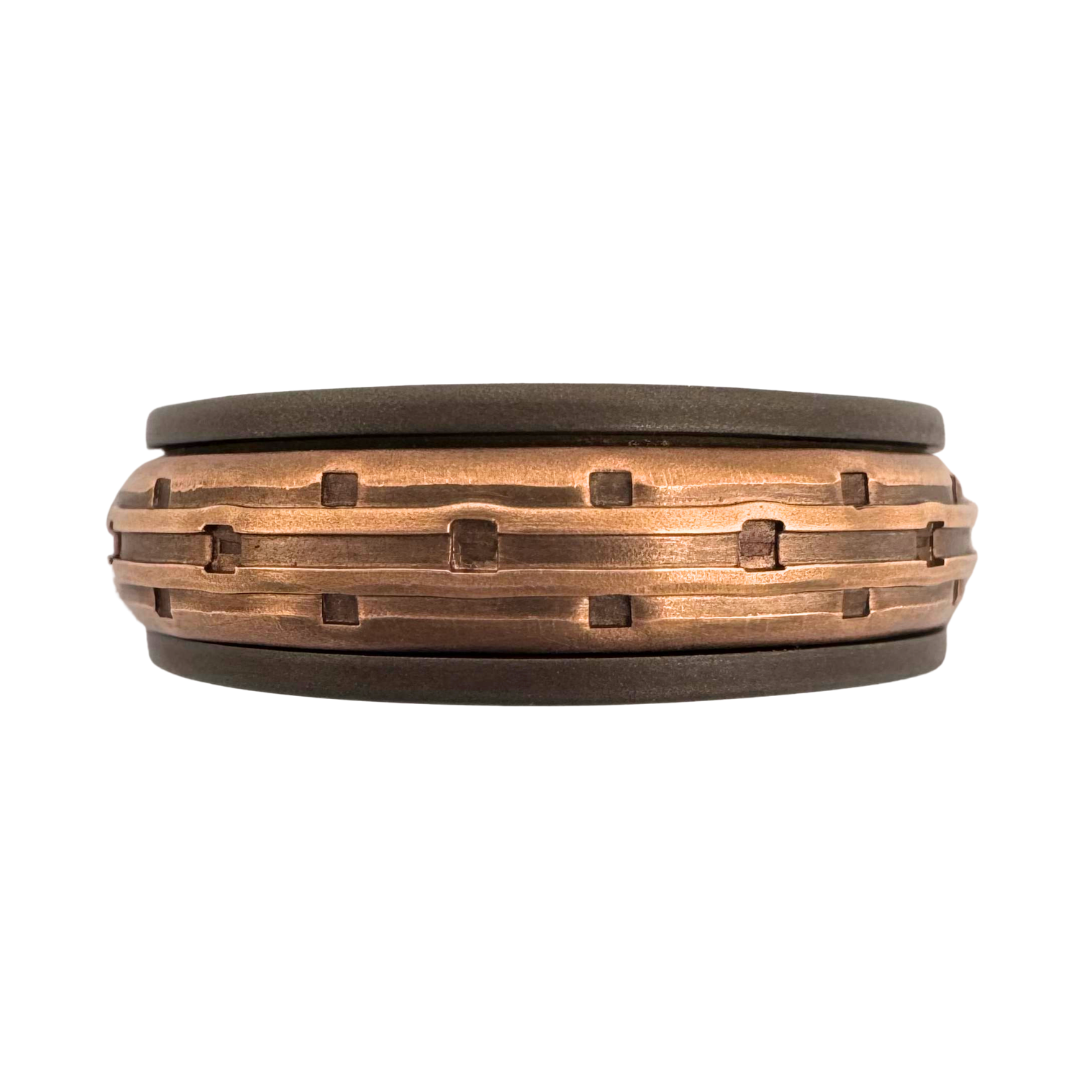 Titanium band with 14K rose gold punch textured spinner band
