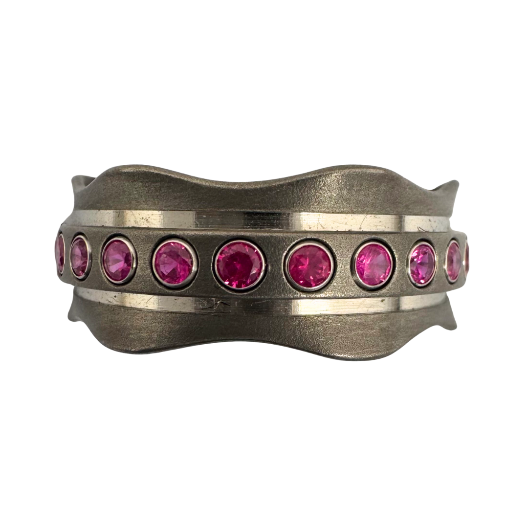 Titanium band set with 24 rubies tube-set in 14K white gold