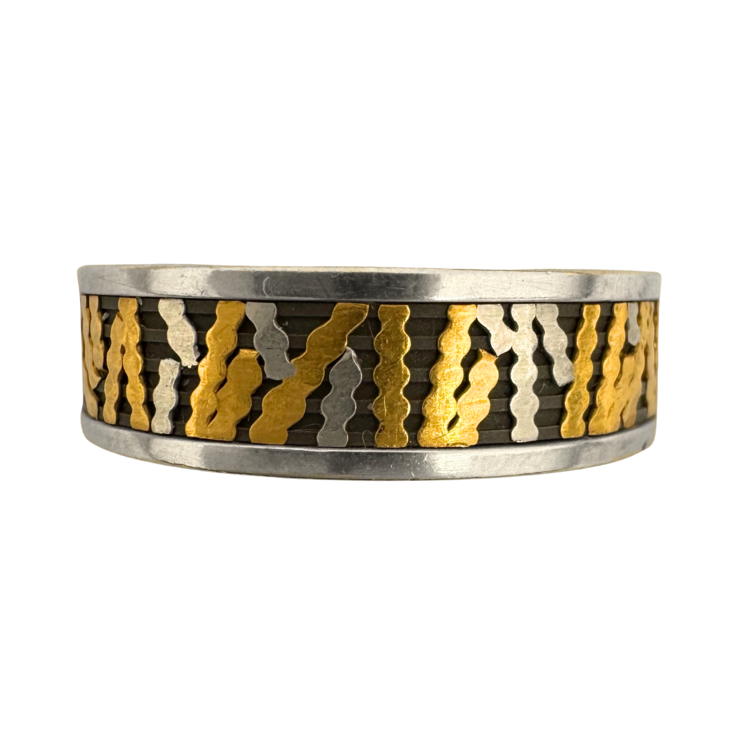 Titanium channeled liner band with 24K gold and pure platinum cross-channel inlays and 14K gold side bands