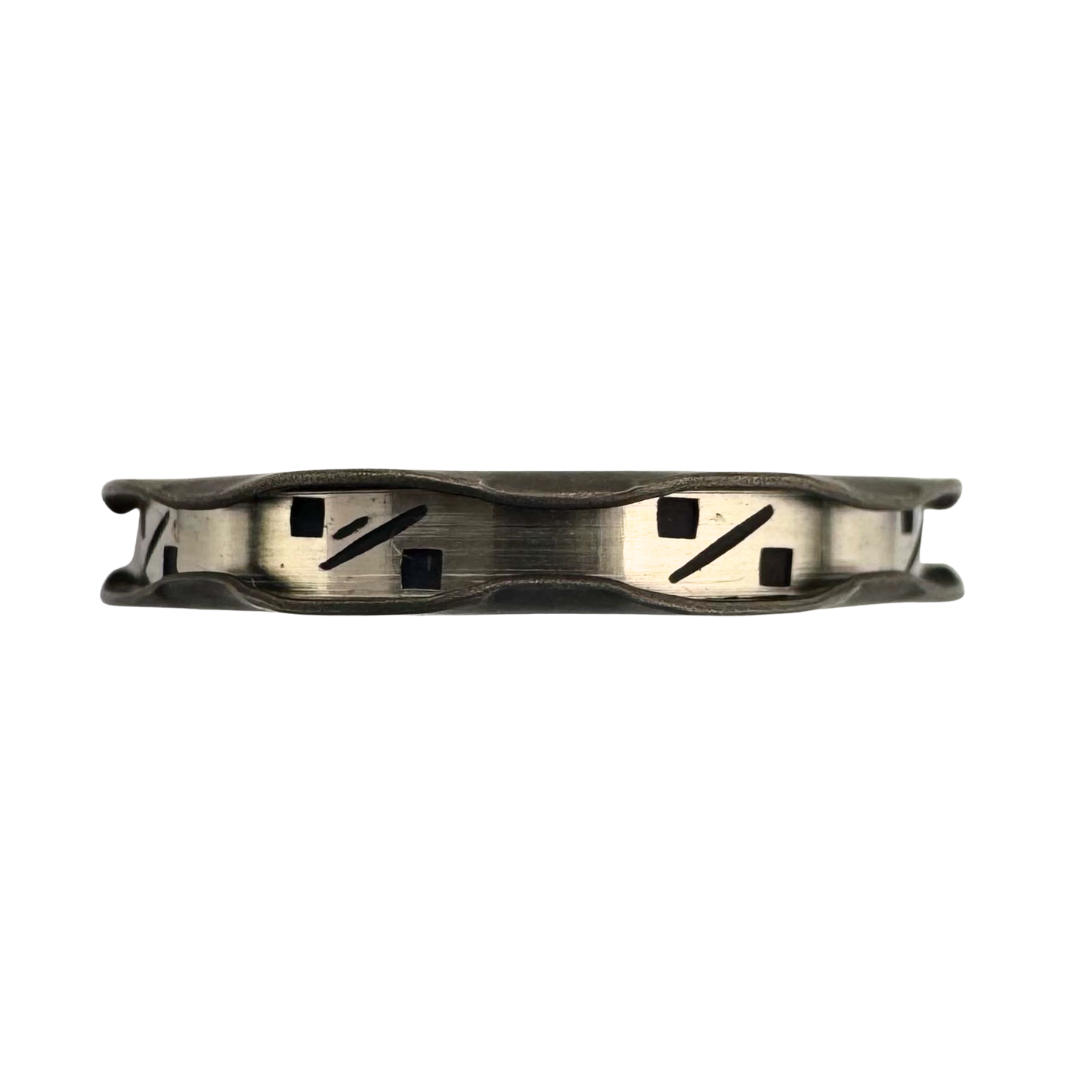 Riffle edged titanium band with punch worked bright-cut channel