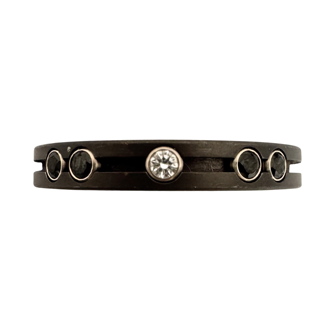 Titanium ring with (6)2mm pink sapphires, (2)2mm diamonds and (4)2mm black spinels in yellow or white gold settings