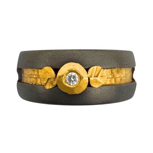 Titanium band with 18K gold setting for (1) 2mm diamond with 24K 'leaves and inlay