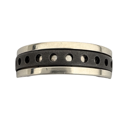 A bright titanium band with a perforated, dark titanium spinner band
