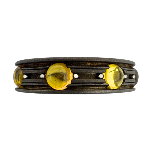 Titanium band with yellow synthetic sapphire cabochons