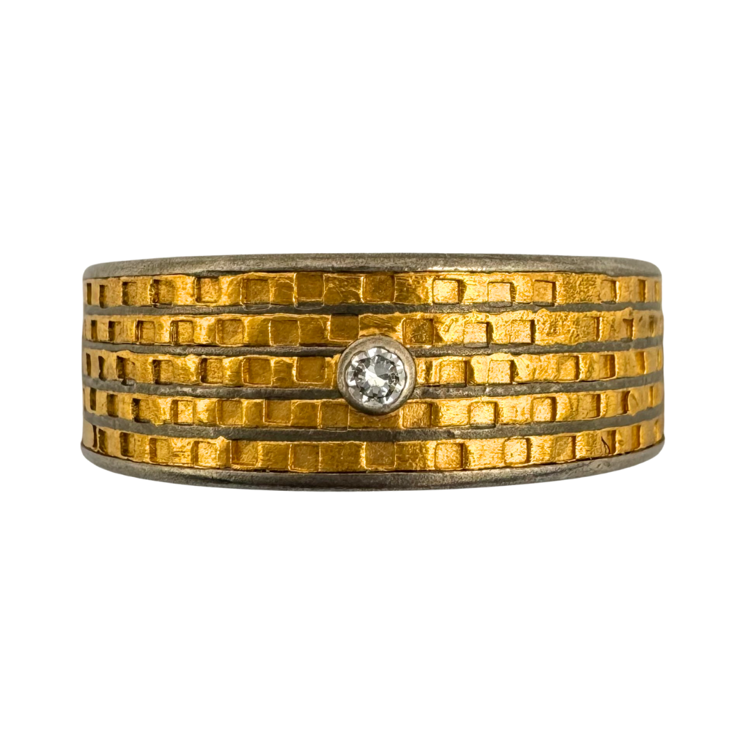 Titanium (5)channel band with textured 24K gold inlay and 2mm diamonds set in 14K white gold on the quarters