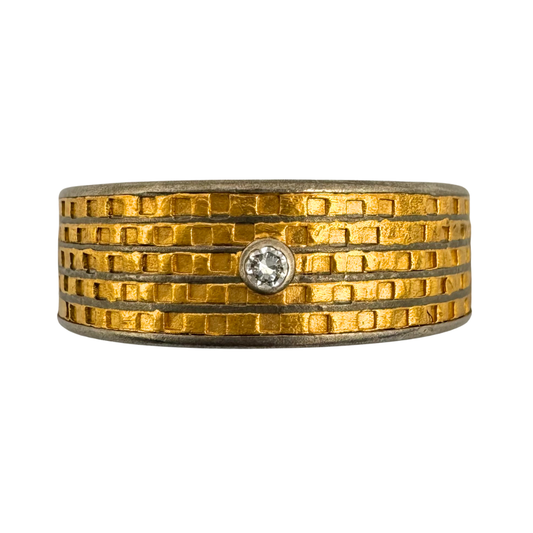 Titanium (5)channel band with textured 24K gold inlay and 2mm diamonds set in 14K white gold on the quarters