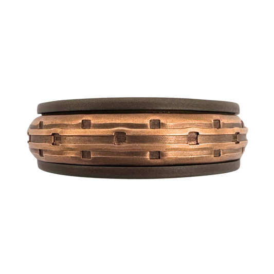 Titanium band with 14K rose gold punch textured spinner band