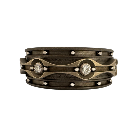 Titanium channeled band with stainless balls and titanium spinner band set with diamonds in 18K gold tube sets