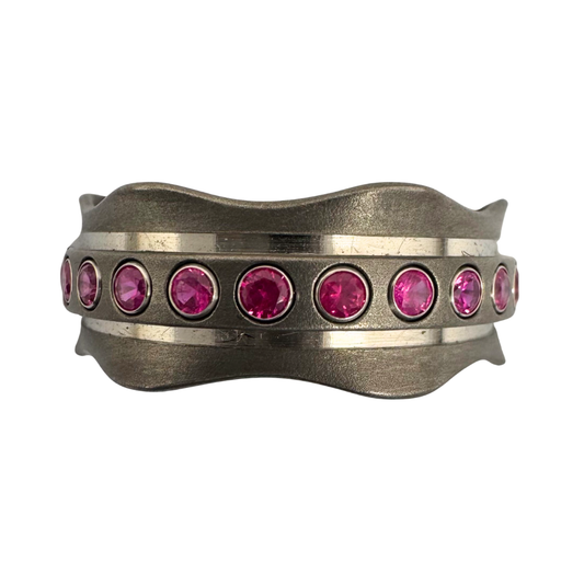 Titanium band set with 24 rubies tube-set in 14K white gold