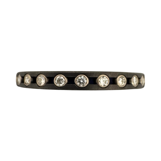 Titanium band with (24)1.5mm diamonds tube set in 18K white gold