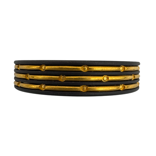 Titanium band with (3)channels of punch worked 24K gold inlay