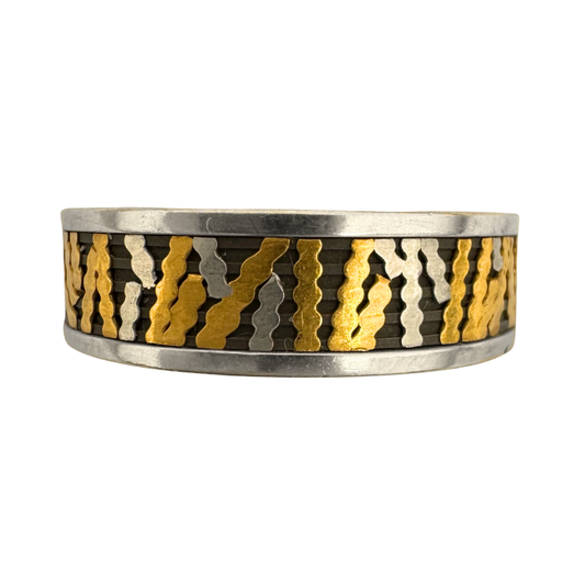 Titanium channeled liner band with 24K gold and pure platinum cross-channel inlays and 14K gold side bands