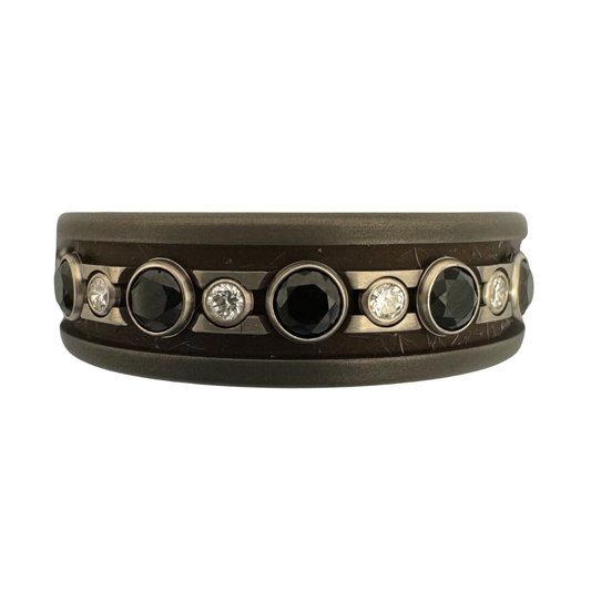 Titanium band with 2.5mm black spinel in and 1.5mm diamonds in white gold tube sets