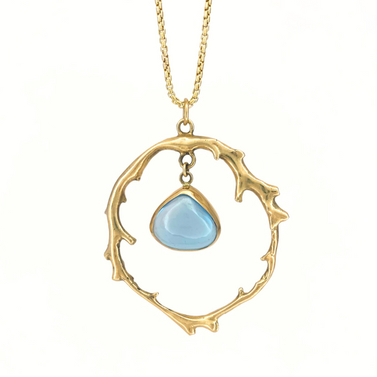 Gold Coral circle with Tear Drop Blue Topaz
