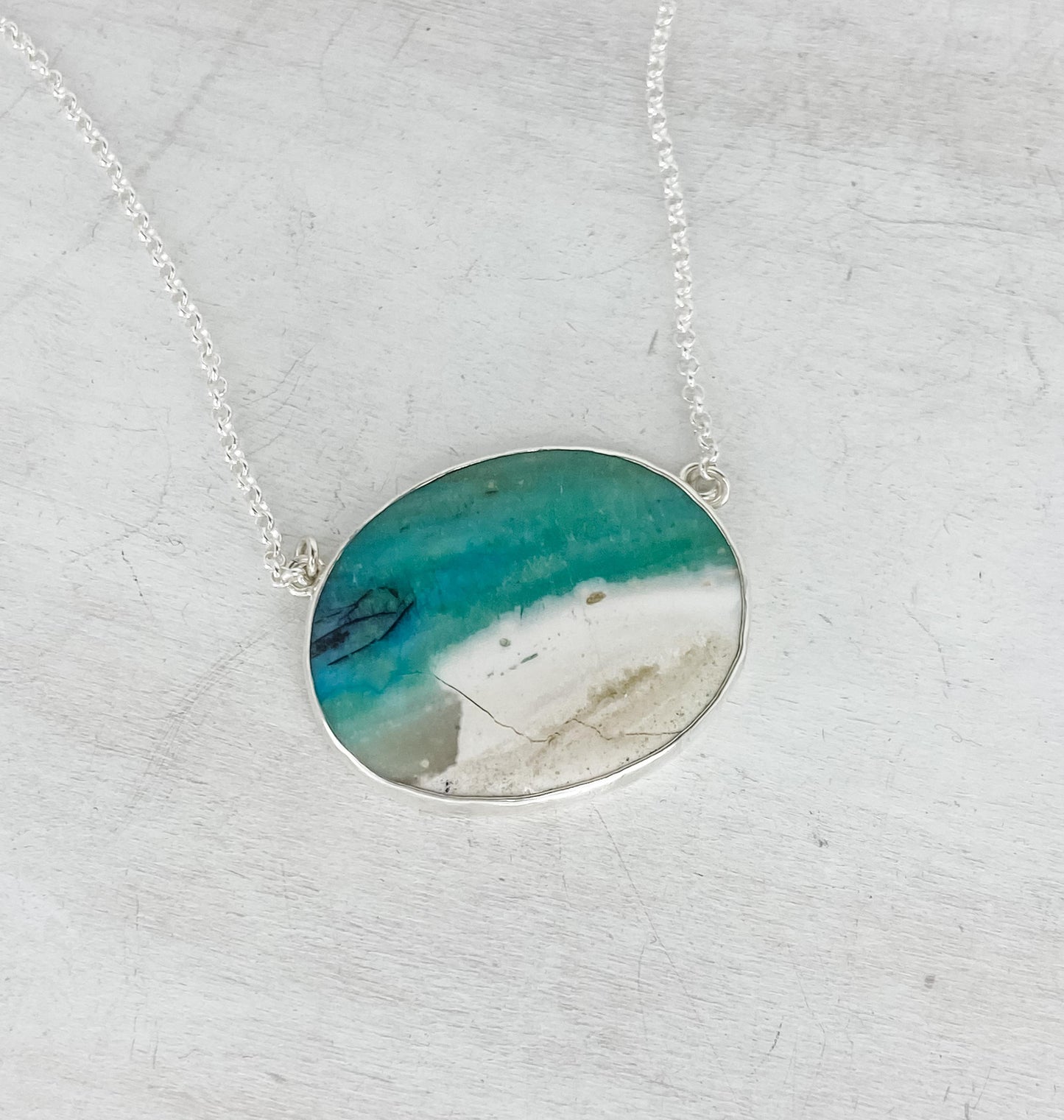 Oval Opalized Wood Pendant with Branch Coral