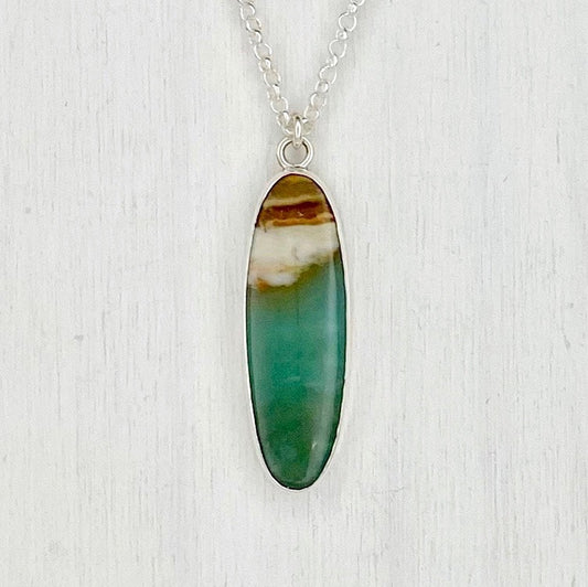 Oval Opalized Wood Pendant with Waves