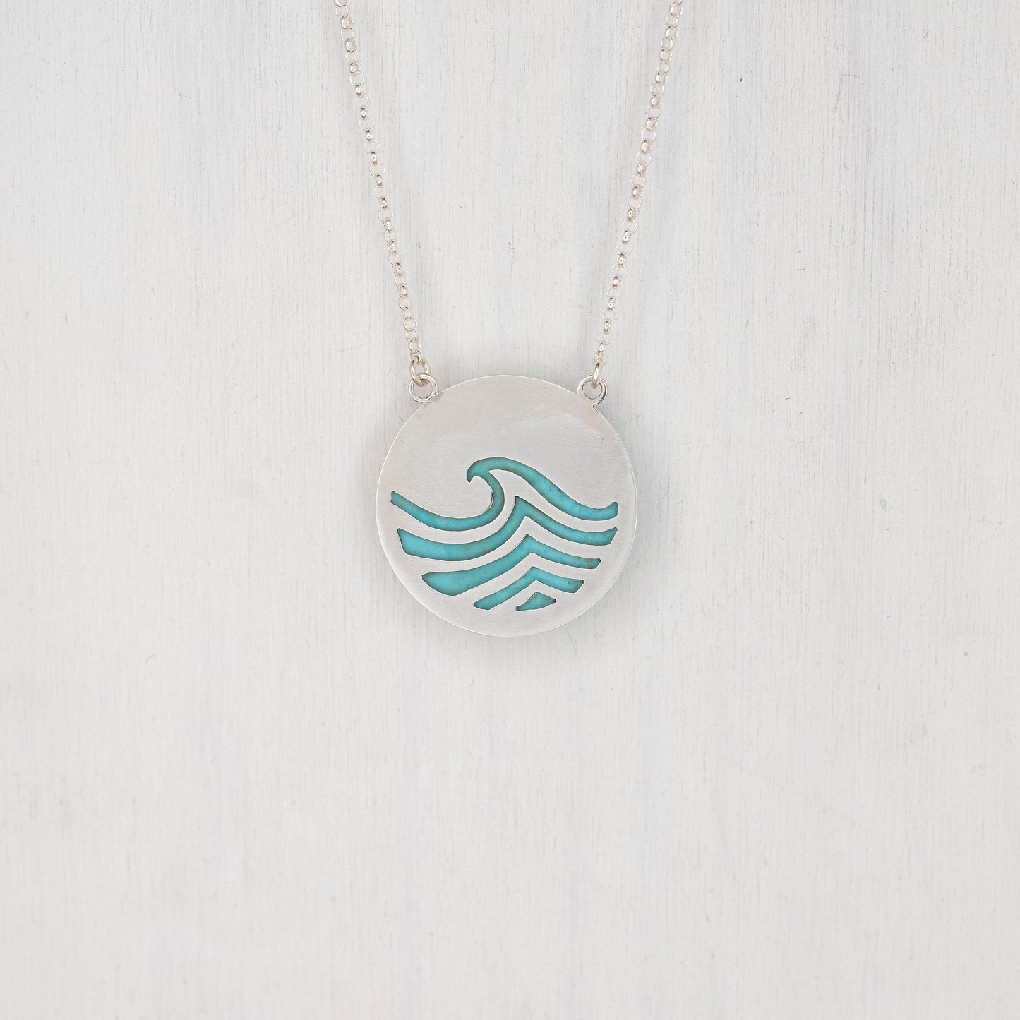 Round Turquoise Pendant with a Wave