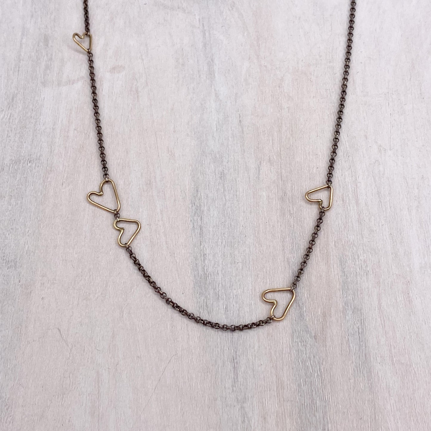 14k Gold Connected Hearts Necklace with Silver Chain